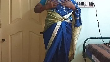 A Lusty Indian Wife In A Clinging Blue Saree, Her Heavy Tits Pressed Tight And Hard Nipples Straining, Fingers Rubbing Her Shaved Cunt As She Masturbates With Wild Desire.