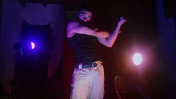 Hulking Studs With Massive Cocks Stroke Their Thick Shafts In The Shadows, Bathed In Purple And Orange Light